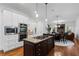 Gourmet kitchen featuring a center island with a gas cooktop and stainless steel appliances at 2660 Pete Shaw Rd, Marietta, GA 30066