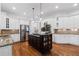 Bright and open kitchen with an island cooktop, stainless steel appliances, and granite countertops at 2660 Pete Shaw Rd, Marietta, GA 30066