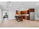 Kitchenette with dark wood cabinetry, a granite counter bar, stainless steel fridge and appliances at 2660 Pete Shaw Rd, Marietta, GA 30066