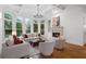 Bright living room with fireplace, coffered ceiling, and many windows overlooking the yard at 2660 Pete Shaw Rd, Marietta, GA 30066