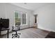 Bright office space with hardwood floors, a desk, and a view of the outdoors at 2660 Pete Shaw Rd, Marietta, GA 30066