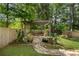 Beautiful pergola with landscaping surrounded by a private backyard that includes a stone walkway at 2660 Pete Shaw Rd, Marietta, GA 30066