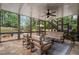Inviting screened-in porch featuring flagstone floors, neutral furnishings, and relaxing views of the backyard at 2660 Pete Shaw Rd, Marietta, GA 30066