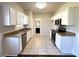 Modern kitchen with stainless steel appliances, granite countertops, and white cabinetry at 417 Bell Flower Trl, Locust Grove, GA 30248