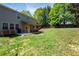 Spacious backyard with covered patio and manicured lawn at 101 Magnolia Creek Dr, Canton, GA 30115
