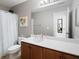 Bathroom featuring a wooden vanity with a white countertop, toilet, and shower with white curtain at 101 Magnolia Creek Dr, Canton, GA 30115
