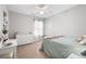 Bright, well-lit bedroom featuring a large window, dresser and plush bed with light-colored linens at 101 Magnolia Creek Dr, Canton, GA 30115