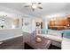 Open-concept living room featuring a comfortable sofa, stylish decor, and seamless transition into the kitchen area at 101 Magnolia Creek Dr, Canton, GA 30115