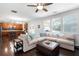 Open-concept living room with hardwood floors, comfortable seating, and a seamless flow to the kitchen at 101 Magnolia Creek Dr, Canton, GA 30115