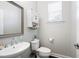 Well-lit powder room featuring a stylish vanity sink, modern fixtures, and a storage cabinet at 101 Magnolia Creek Dr, Canton, GA 30115