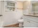 Clean bathroom featuring a tiled wall, granite countertop, and new fixtures at 2724 Quincy Ln, Decatur, GA 30034