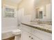 Bright bathroom featuring wood look flooring, modern vanity, and updated fixtures at 2724 Quincy Ln, Decatur, GA 30034