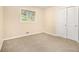 Bedroom featuring neutral carpeting, closet, and fresh paint at 2724 Quincy Ln, Decatur, GA 30034