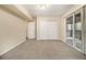 Bright bedroom with plush carpeting, a sliding door to the outside, and a closet at 2724 Quincy Ln, Decatur, GA 30034