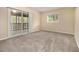 Comfortable bedroom with plush carpeting, a sliding door, and a window overlooking the serene outdoors at 2724 Quincy Ln, Decatur, GA 30034