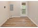 The laundry room is complete with hardwood floors and convenient access to the outdoors at 2724 Quincy Ln, Decatur, GA 30034