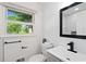 Modern bathroom featuring stylish fixtures and a sleek vanity at 3456 Thornewood Dr, Atlanta, GA 30340