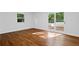 A bright bedroom featuring hard wood floors and direct access to a patio at 3456 Thornewood Dr, Atlanta, GA 30340
