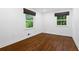 Bright bedroom with hardwood floors and ample natural light from two windows at 3456 Thornewood Dr, Atlanta, GA 30340