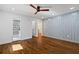 Spacious bedroom with hardwood floors, a ceiling fan, and ample natural light at 3456 Thornewood Dr, Atlanta, GA 30340