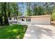 Beautiful two-story home with a well-manicured lawn and a two-car garage at 3456 Thornewood Dr, Atlanta, GA 30340