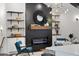 Close-up of living room fireplace with built-in shelves, designer details, and ambient lighting at 3456 Thornewood Dr, Atlanta, GA 30340