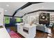 Open concept kitchen with an island, dining area, and view into a stylish living room at 3456 Thornewood Dr, Atlanta, GA 30340