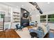 Bright living room showcasing hardwood floors, fireplace feature, and stylish contemporary design at 3456 Thornewood Dr, Atlanta, GA 30340