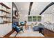 Spacious open concept living room with hardwood floors, and seamless flow to kitchen area at 3456 Thornewood Dr, Atlanta, GA 30340