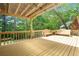 Comfortable covered back deck with bench seating at 3460 Highgate Hills Ne Dr, Duluth, GA 30097