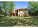 Large, well-maintained backyard featuring mature trees and a deck with a hot tub at 3460 Highgate Hills Ne Dr, Duluth, GA 30097