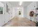 Unfinished garage with door to outside, features a water heater and ample storage or workspace at 3460 Highgate Hills Ne Dr, Duluth, GA 30097