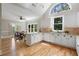 Bright kitchen features white cabinetry, granite countertops, stainless steel appliances, and eat-in area at 3460 Highgate Hills Ne Dr, Duluth, GA 30097
