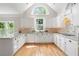 Bright kitchen with white cabinets, granite countertops, and hardwood floors at 3460 Highgate Hills Ne Dr, Duluth, GA 30097