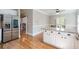Kitchen features a breakfast bar, stainless steel refrigerator and door to the breakfast nook at 3460 Highgate Hills Ne Dr, Duluth, GA 30097