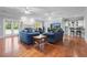 Spacious living room with hardwood floors, fireplace, and ample seating at 3460 Highgate Hills Ne Dr, Duluth, GA 30097
