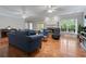 Spacious living room with hardwood floors, fireplace and comfortable seating with bright natural light at 3460 Highgate Hills Ne Dr, Duluth, GA 30097