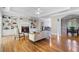 Bright and spacious living room with built-in shelving, fireplace, hardwood floors, and elegant furniture at 3460 Highgate Hills Ne Dr, Duluth, GA 30097