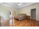 Large main bedroom with hardwood floors and access to a private outdoor patio through french doors at 3460 Highgate Hills Ne Dr, Duluth, GA 30097