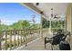 Relax on this porch, featuring ceiling fans and stunning views of the surrounding greenery at 3460 Highgate Hills Ne Dr, Duluth, GA 30097