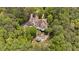 Aerial view of estate showing pool, tennis court and mature tree coverage at 4340 Candacraig, Johns Creek, GA 30022