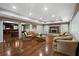 Finished basement with hardwood floors, fireplace, and adjoining bar area at 4340 Candacraig, Johns Creek, GA 30022