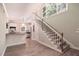 Entryway to kitchen with a staircase leading to upper level and hardwood floors at 4340 Candacraig, Johns Creek, GA 30022