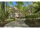 Elegant brick house with a circular driveway and beautiful landscaping at 4340 Candacraig, Johns Creek, GA 30022