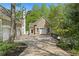Charming guest house features stone exterior and a private driveway at 4340 Candacraig, Johns Creek, GA 30022