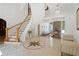 Expansive foyer featuring a curved staircase, intricate tile flooring, and an elegant chandelier at 4340 Candacraig, Johns Creek, GA 30022