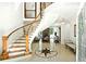 Grand foyer featuring a curved staircase, marble flooring with star medallion, and elegant chandelier at 4340 Candacraig, Johns Creek, GA 30022