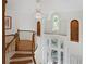 Elegant foyer showcasing a chandelier, curved staircase, and stained glass windows at 4340 Candacraig, Johns Creek, GA 30022