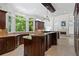 Spacious kitchen featuring granite countertops, center island with view of the adjacent living area at 4340 Candacraig, Johns Creek, GA 30022