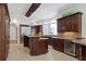 Gourmet kitchen with granite countertops, wine cooler, and stainless steel appliances at 4340 Candacraig, Johns Creek, GA 30022